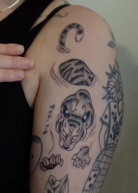 Swimming tiger by Katie Byrne at Ink and Water tattoo in Toronto, Canada