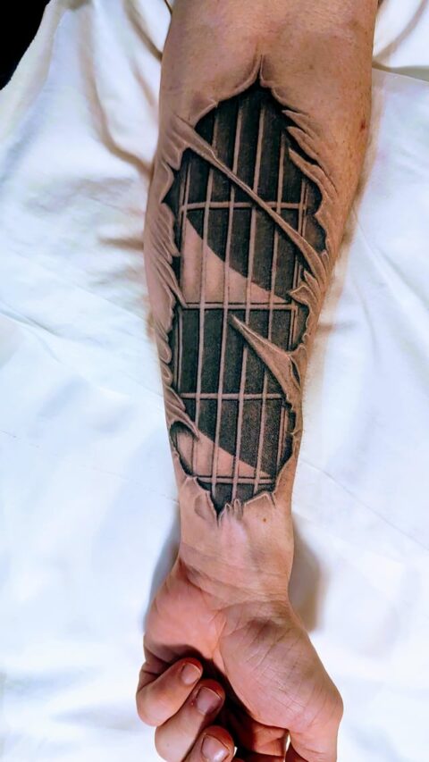 Guitar fretboard forearm tattoo by Ramon Herido in Manila