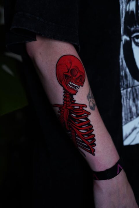Red skeleton, done by me at Delete After Death in Toronto